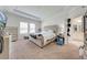 Comfortable main bedroom featuring a neutral color palette, plush carpet, and an en-suite bathroom at 3312 Cordgrass Pl, St Cloud, FL 34773
