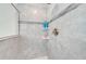 Close-up of shower with tiled walls, built-in shelving, and modern fixtures at 3312 Cordgrass Pl, St Cloud, FL 34773