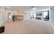 Open upstairs living area with carpet, a media center, and plenty of natural light at 3312 Cordgrass Pl, St Cloud, FL 34773