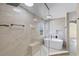 Modern bathroom features a standalone tub, frameless shower, and marble tile at 3331 Morelyn Crest Cir, Orlando, FL 32828