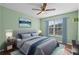 A comfortable bedroom with blue accents and plenty of natural light, creating a welcoming atmosphere at 3331 Morelyn Crest Cir, Orlando, FL 32828