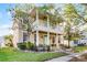 Charming two-story home with double porches, grand columns, and a meticulously landscaped front yard at 3331 Morelyn Crest Cir, Orlando, FL 32828