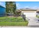 Charming home exterior with well-manicured lawn and fenced yard at 3331 Morelyn Crest Cir, Orlando, FL 32828