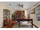 A charming home office featuring built in bookcases, rich wood floors, and a large window for ample natural light at 3331 Morelyn Crest Cir, Orlando, FL 32828
