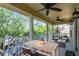 Spacious covered patio offers outdoor dining and picturesque lake views at 3331 Morelyn Crest Cir, Orlando, FL 32828