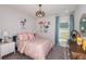 Charming bedroom showcases lively decor, complementary colors, and a cozy, well-lit space at 3529 Yarian Dr, Haines City, FL 33844