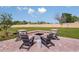 The brick-paved backyard area includes a fire pit with comfortable Adirondack seating at 3529 Yarian Dr, Haines City, FL 33844