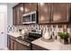 Close-up of modern kitchen featuring stainless steel appliances and a decorative tile backsplash at 3529 Yarian Dr, Haines City, FL 33844