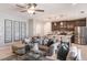 Open-concept living room and kitchen with contemporary furnishings and a spacious layout at 3529 Yarian Dr, Haines City, FL 33844