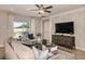 Inviting living room with sliding glass doors to the backyard and stylish decor at 3529 Yarian Dr, Haines City, FL 33844