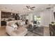 Bright living room with a modern kitchen view, contemporary furnishings, and lots of natural light at 3529 Yarian Dr, Haines City, FL 33844