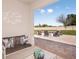 Inviting outdoor patio features a cozy seating area and a beautiful brick fire pit at 3529 Yarian Dr, Haines City, FL 33844