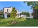 Expansive backyard showcasing lush lawn and mature trees, enhancing privacy and outdoor enjoyment at 3608 Dubsdread Cir, Orlando, FL 32804