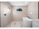 Elegant bathroom boasts a modern tub, glass shower, and stylish fixtures at 3608 Dubsdread Cir, Orlando, FL 32804