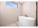 Close-up of a luxurious bathroom featuring a modern tub and elegant tile work at 3608 Dubsdread Cir, Orlando, FL 32804