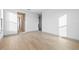 This is a bedroom with hardwood floors and access to multiple rooms at 3608 Dubsdread Cir, Orlando, FL 32804