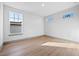 This is a bedroom with hardwood floors and multiple windows providing natural light at 3608 Dubsdread Cir, Orlando, FL 32804