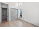 Bright bedroom features hardwood floors, closet, and two windows allowing lots of natural light at 3608 Dubsdread Cir, Orlando, FL 32804