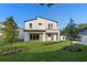 Stunning modern home with second-story balcony overlooking a lush backyard, perfect for outdoor living at 3608 Dubsdread Cir, Orlando, FL 32804