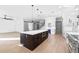 Spacious open-concept kitchen with large island, stainless steel appliances, and hardwood flooring at 3608 Dubsdread Cir, Orlando, FL 32804