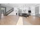 Bright, open floor plan with a large kitchen island, modern appliances, and hardwood floors at 3608 Dubsdread Cir, Orlando, FL 32804