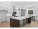 Well-equipped kitchen boasts stainless appliances, a central island, and plenty of counter space at 3608 Dubsdread Cir, Orlando, FL 32804