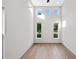 Bright living room with multiple windows and hardwood flooring at 3608 Dubsdread Cir, Orlando, FL 32804
