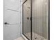 Modern shower featuring a glass enclosure, sleek fixtures and a pebble floor at 3608 Dubsdread Cir, Orlando, FL 32804