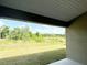 A stunning view of lush greenery that has a covered patio to enjoy the scenic outdoor setting at 4278 Sagefield Dr, St Cloud, FL 34773