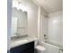 Clean bathroom featuring a bathtub/shower combo, granite countertop, and modern fixtures at 4278 Sagefield Dr, St Cloud, FL 34773
