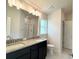 Bathroom featuring granite countertops, a double sink vanity, and a glass shower at 4278 Sagefield Dr, St Cloud, FL 34773