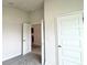 Neutral bedroom with carpet flooring and a white door at 4278 Sagefield Dr, St Cloud, FL 34773