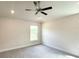 A bright bedroom featuring a modern ceiling fan, recessed lighting, and a sunlit window at 4278 Sagefield Dr, St Cloud, FL 34773