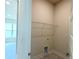 Functional laundry room with shelving and hookups, conveniently located near living areas at 4278 Sagefield Dr, St Cloud, FL 34773
