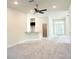 Spacious living room featuring a breakfast bar, ceiling fan, and ample natural light at 4278 Sagefield Dr, St Cloud, FL 34773