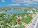 Aerial view pinpointing property location, near a lake, lush greenery, and a major roadway at 430 S Dollins Ave, Orlando, FL 32805
