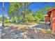 The spacious backyard is a blank canvas with mature trees providing ample shade at 430 S Dollins Ave, Orlando, FL 32805