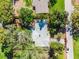 Aerial shot of a single-Gathering home featuring mature trees and a partial view of the roof at 505 Lake Shore Dr, Maitland, FL 32751