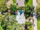 Aerial shot of a single-Gathering home featuring mature trees and a partial view of the roof at 505 Lake Shore Dr, Maitland, FL 32751