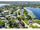 Aerial shot showing a neighborhood next to a lake, with homes and mature landscaping at 505 Lake Shore Dr, Maitland, FL 32751