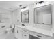 Bright bathroom featuring dual sinks and modern fixtures at 505 Lake Shore Dr, Maitland, FL 32751