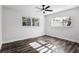 Bright bedroom featuring lots of natural light, ceiling fan, and stylish wood-look flooring at 505 Lake Shore Dr, Maitland, FL 32751