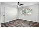 A clean and spacious bedroom with hardwood floors and a ceiling fan at 505 Lake Shore Dr, Maitland, FL 32751
