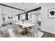 Dining room with marble-top table and seating, and a view of a modern living area at 505 Lake Shore Dr, Maitland, FL 32751