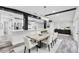 Bright dining room with a modern chandelier and an open view to the kitchen and living areas at 505 Lake Shore Dr, Maitland, FL 32751