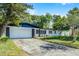 Charming single-story home with a well-manicured lawn and mature trees offering curb appeal at 505 Lake Shore Dr, Maitland, FL 32751