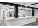 Bright open-concept kitchen featuring modern stainless steel appliances and white countertops at 505 Lake Shore Dr, Maitland, FL 32751
