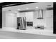 Bright kitchen with stainless appliances, white cabinets, and subway tile backsplash at 505 Lake Shore Dr, Maitland, FL 32751