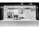 Updated kitchen with white cabinets, modern appliances, and ample countertop space at 505 Lake Shore Dr, Maitland, FL 32751