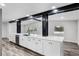 Modern kitchen features white cabinets, stainless steel appliances, and a large countertop at 505 Lake Shore Dr, Maitland, FL 32751